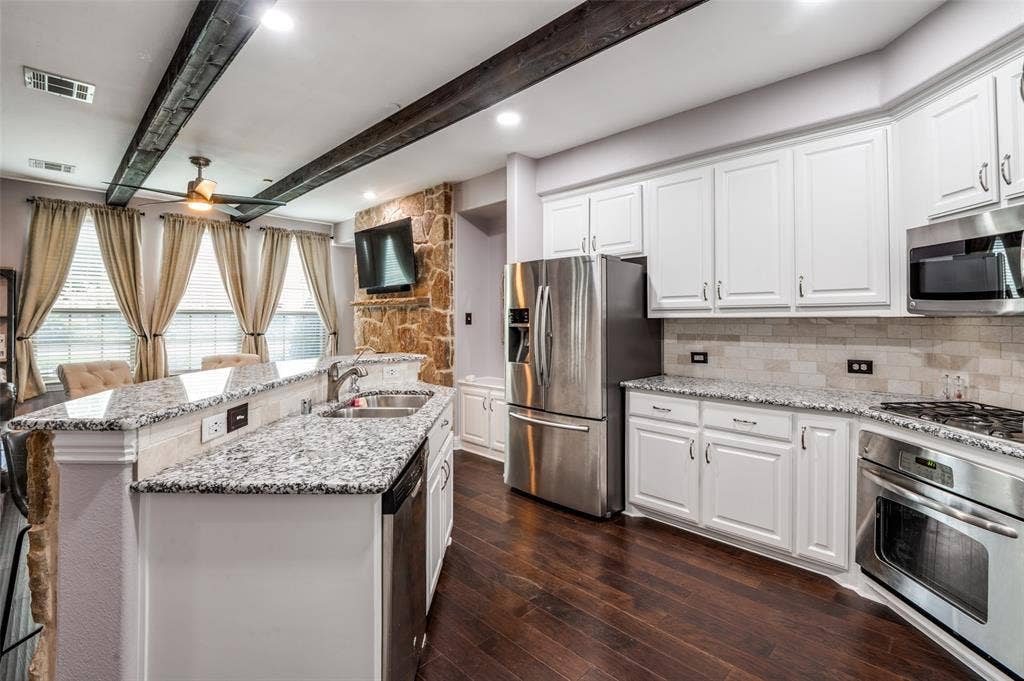 5707 Headquarters Drive, Plano, TX 75024 Upgraded Granite & Backplash in Kitchen Matches Cabinets