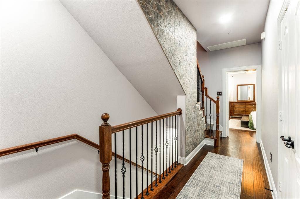 5707 Headquarters Drive, Plano, TX 75024 Staircase with Stone Accent Wall