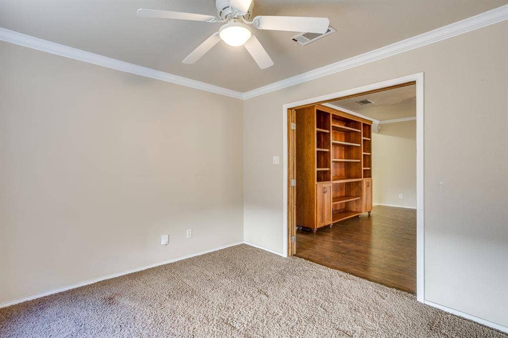 Recessed lighting, crown molding, ceiling fan, and carpeted flooring