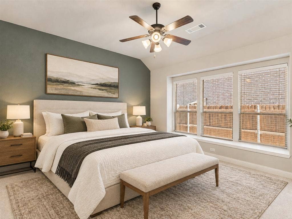 1020 Fallon Drive, McKinney, TX 75071 Recessed ceiling with an angled wall accent, three large windows, a ceiling fan with integrated lighting, and carpet flooring