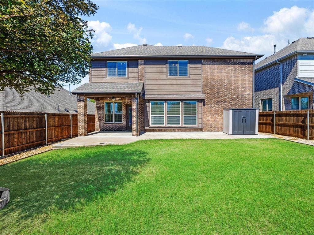1020 Fallon Drive, McKinney, TX 75071 Expansive backyard with a covered patio, concrete slab, and privacy fencing