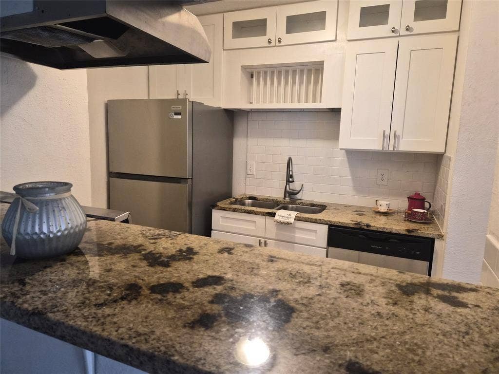 8110 Skillman Street, #2059, Dallas, TX 75231 Cabinets and countertops were iupdated a few years ago