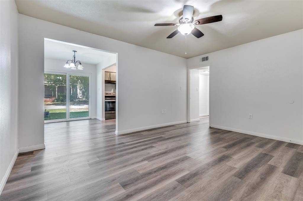 428 N Dallas Avenue, #3, Lancaster, TX 75146 Wood-finish flooring throughout, ceiling fan with integrated lighting, and white wall finishes