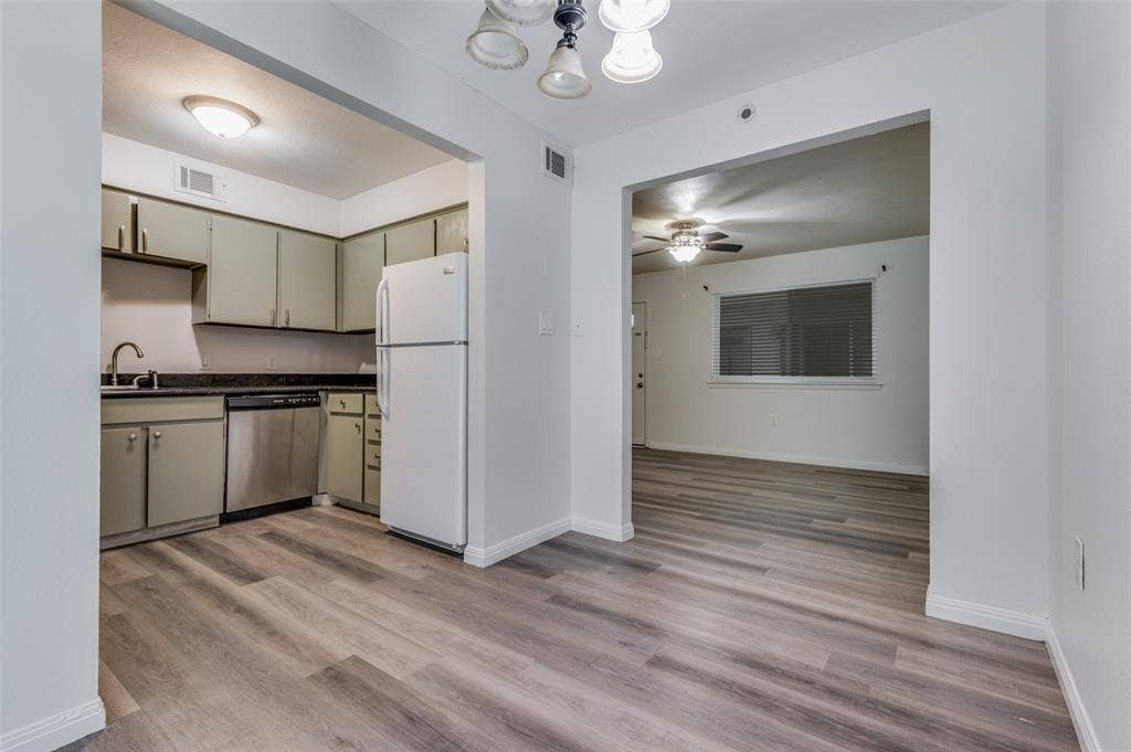 428 N Dallas Avenue, #3, Lancaster, TX 75146 Kitchen with dark countertops, a stainless steel dishwasher, and a white refrigerator