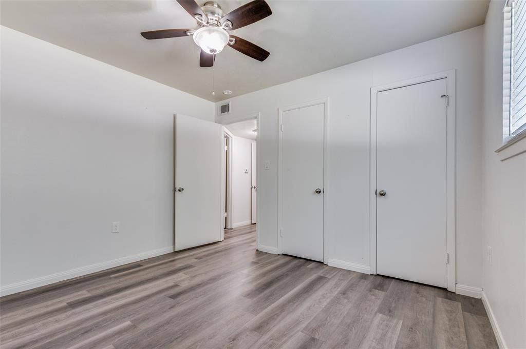 428 N Dallas Avenue, #3, Lancaster, TX 75146 Wood-finish flooring, ceiling fan with integrated lighting, window with blinds, and white interior doors