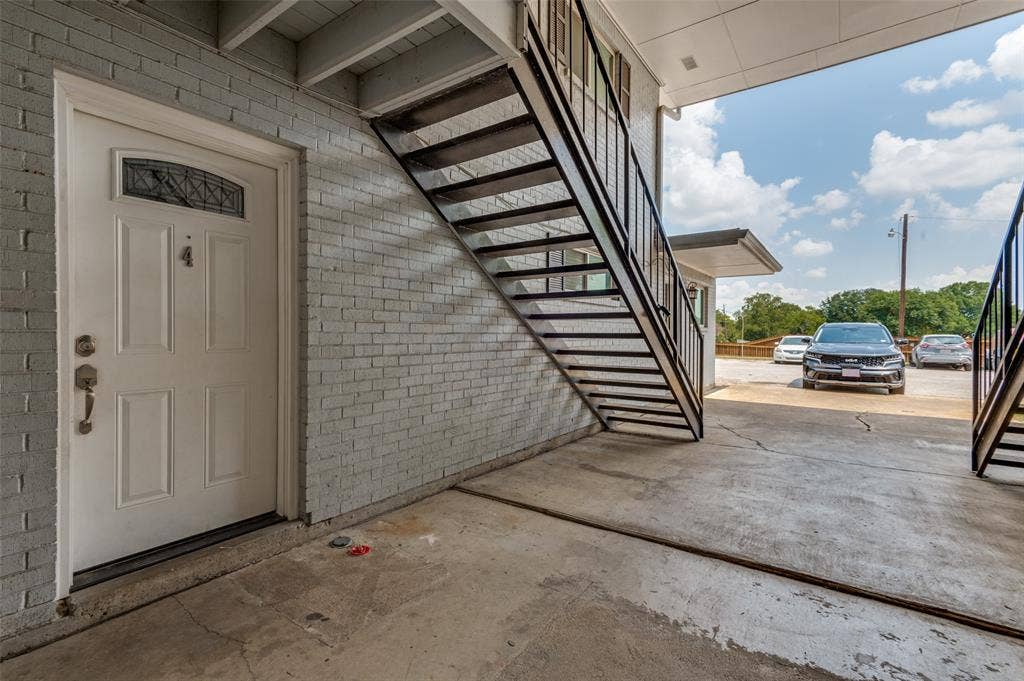 428 N Dallas Avenue, #3, Lancaster, TX 75146 White entry door with decorative glass insert, paneled design, and classic hardware