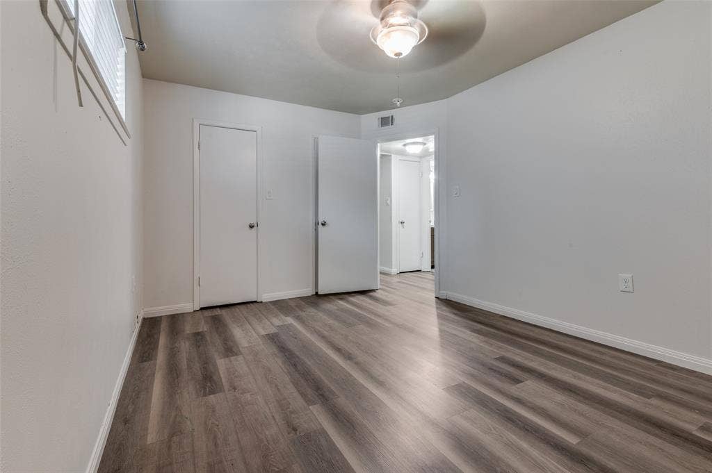 428 N Dallas Avenue, #3, Lancaster, TX 75146 Wood-finish flooring throughout, white interior doors, and a ceiling fan with integrated lighting