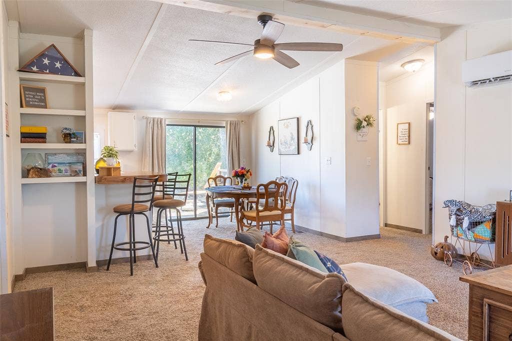Living Room leads into Dining, then Kitchen