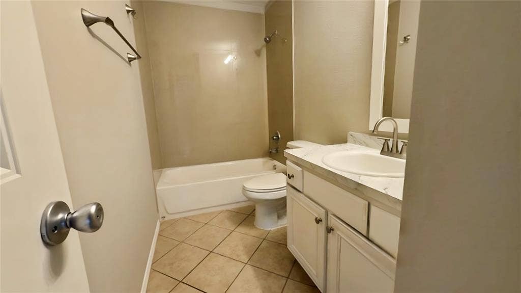 White vanity with an integrated sink and brushed nickel faucet