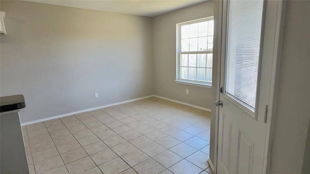 Neutral wall tones complemented by light-toned tile flooring