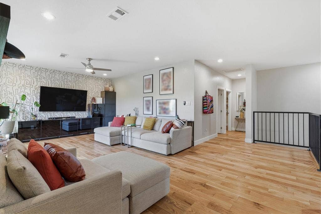 709 Woodbine Avenue, Dallas, TX 75203 Open-concept living space featuring wood-finish flooring, recessed lighting, and a ceiling fan