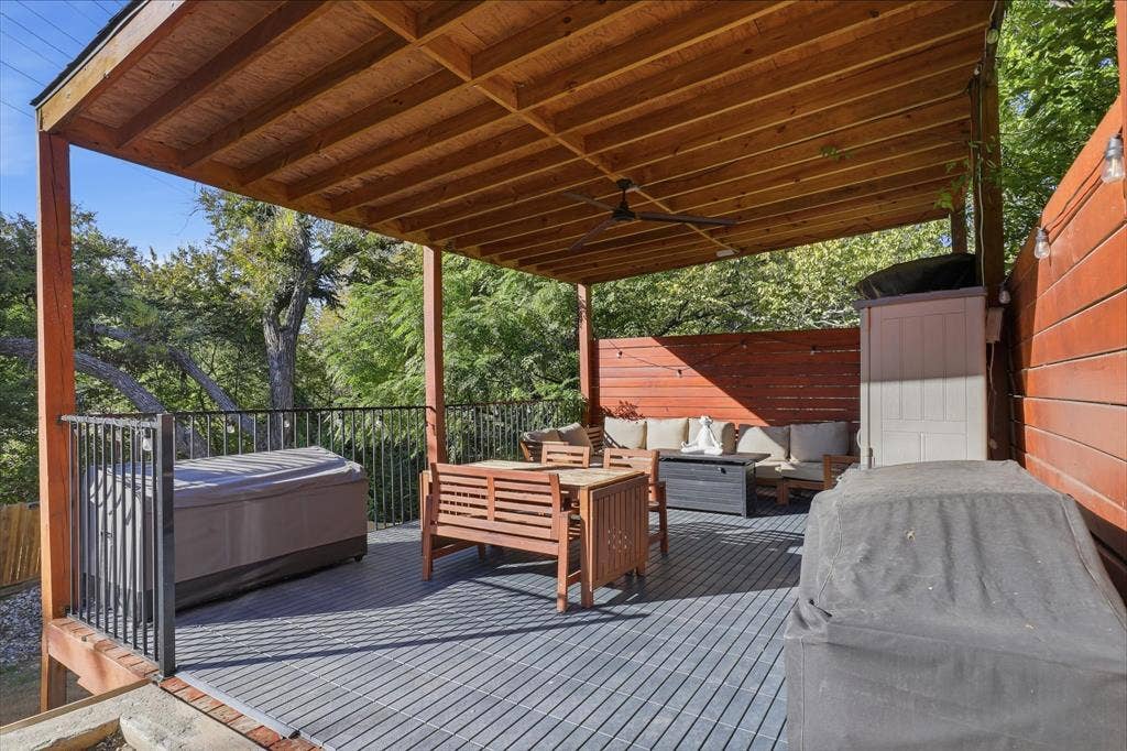 709 Woodbine Avenue, Dallas, TX 75203 Expansive covered deck with composite decking, slatted wood ceiling, and integrated ceiling fan