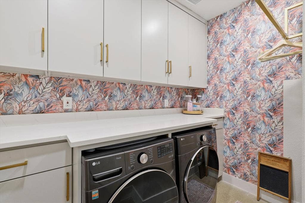 709 Woodbine Avenue, Dallas, TX 75203 White cabinetry with gold-tone hardware, white countertops, and wallpaper