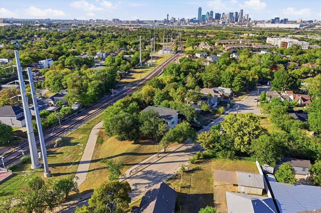 709 Woodbine Avenue, Dallas, TX 75203 Suburban landscape with significant tree canopy and residential properties