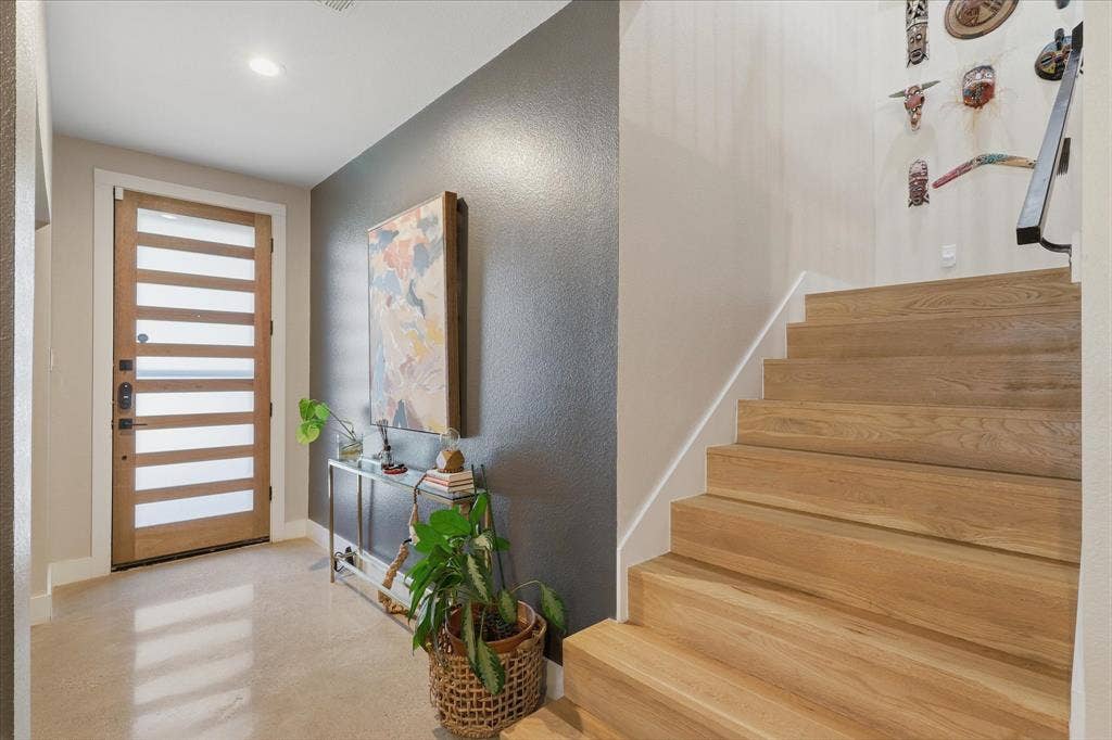709 Woodbine Avenue, Dallas, TX 75203 Modern wood-finish entry door with horizontal glass panels