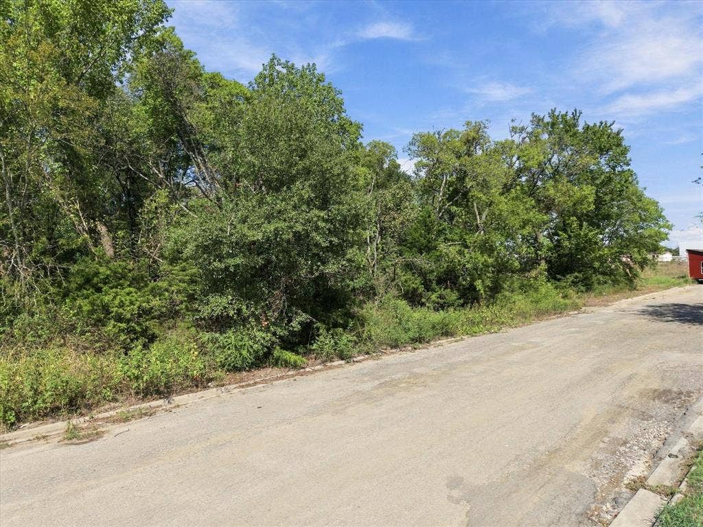 TBD N Neal Street, Commerce, TX 75428 Mature trees line this almost 8 acre parcel