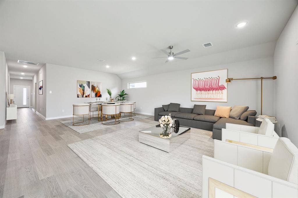 1121 Sundog Drive, Princeton, TX 75407 Dining and Living Room in the Hayden home plan – REPRESENTATIVE PHOTO