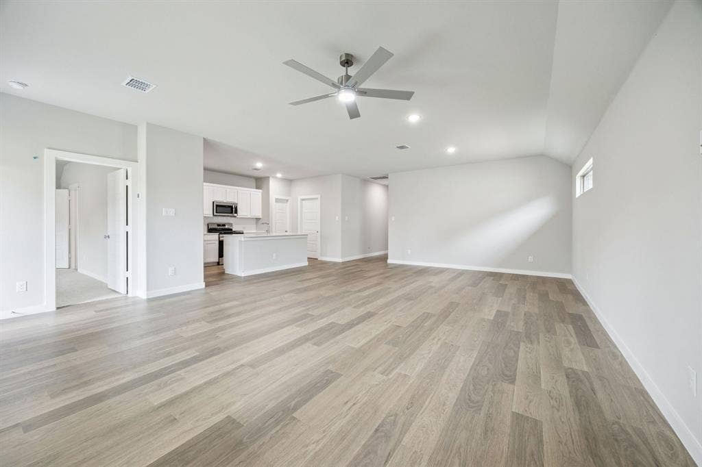 1121 Sundog Drive, Princeton, TX 75407 Dining and Living Room in the Hayden home plan – REPRESENTATIVE PHOTO