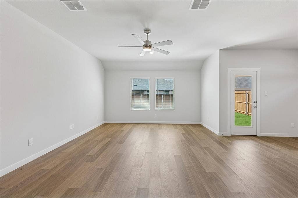 2304 Warm Glow Way, Princeton, TX 75407 Living Room in the Harrison home plan – REPRESENTATIVE PHOTO