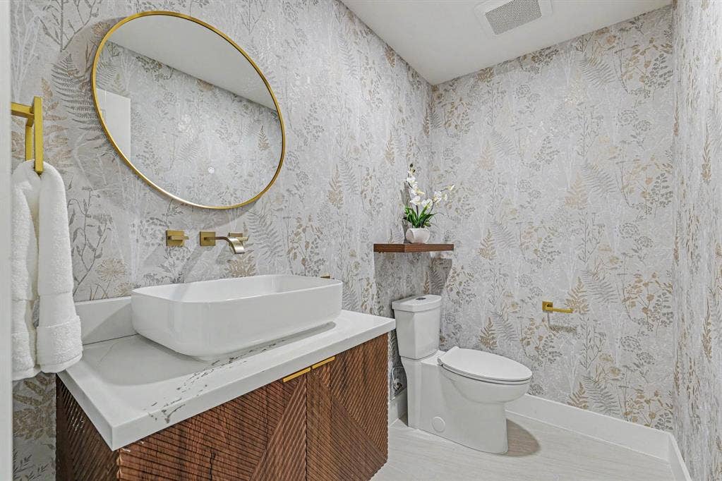 4004 Cedar Bayou Drive, Dallas, TX 75244 Powder room with a vessel sink, wall-mounted faucet, and patterned wall covering