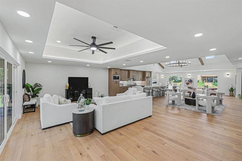 4004 Cedar Bayou Drive, Dallas, TX 75244 Recessed lighting, wood-finish flooring, sliding glass doors, contemporary ceiling fan, and open-concept design