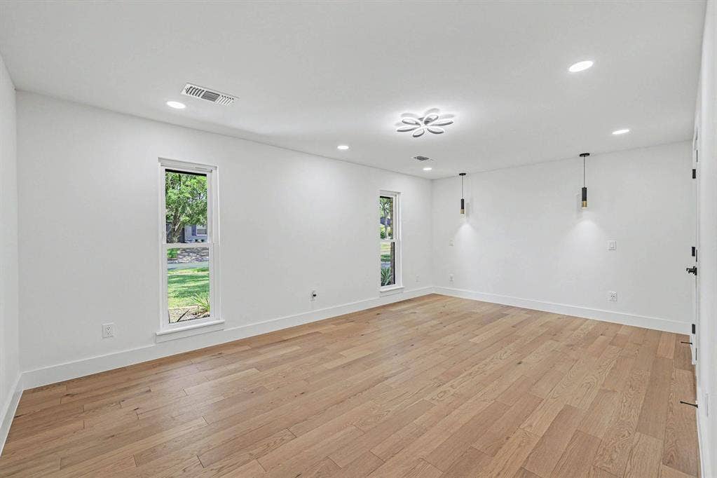4004 Cedar Bayou Drive, Dallas, TX 75244 Recessed lighting, wood-finish flooring, and white walls