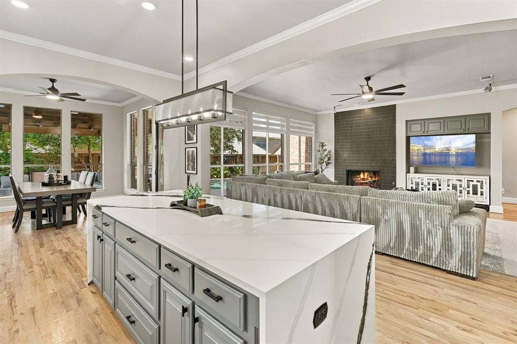 Kitchen and Family Room | View across the granite island highlights the open connection to the family room and breakfast area.