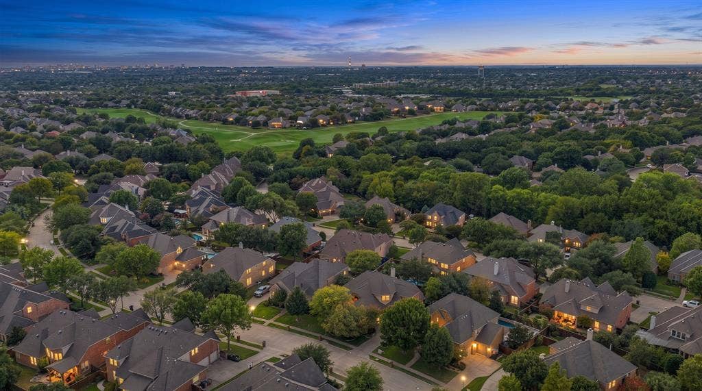 Neighborhood Aerial View | Elevated view shows the surrounding residential streets, mature tree canopy and wider Stonebridge Ranch setting.