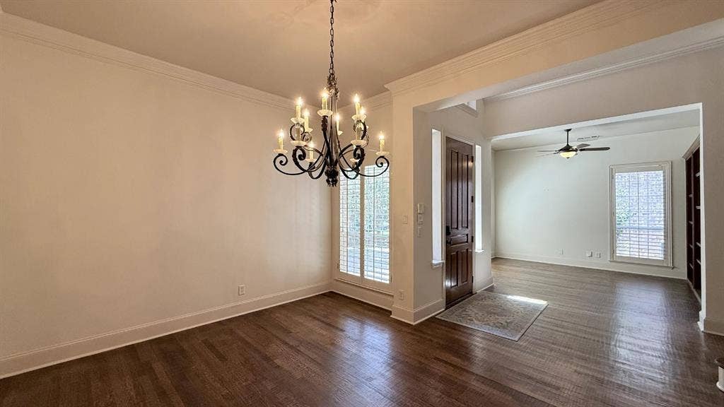 5700 Travis Drive, Frisco, TX 75034 Hardwood flooring, crown molding, wrought iron chandelier, plantation shutters, and built-in shelving