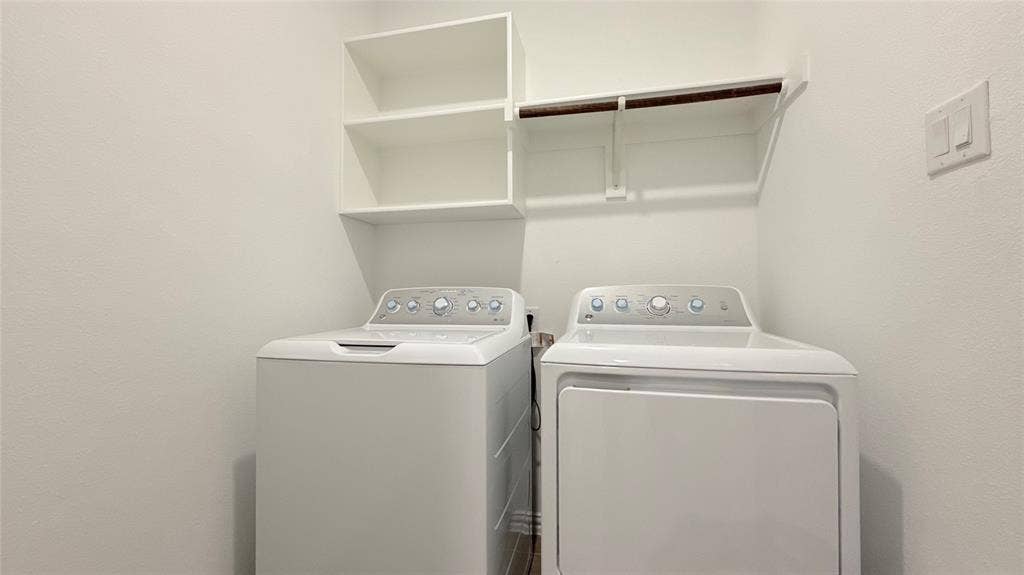 Built-in shelving and a clothing rod provide organized storage