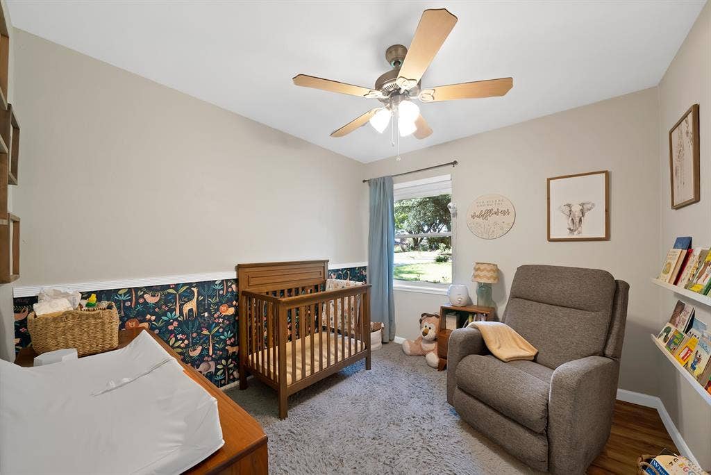 1400 Lorrie Drive, Richardson, TX 75080 Bedroom with a crib and ceiling fan