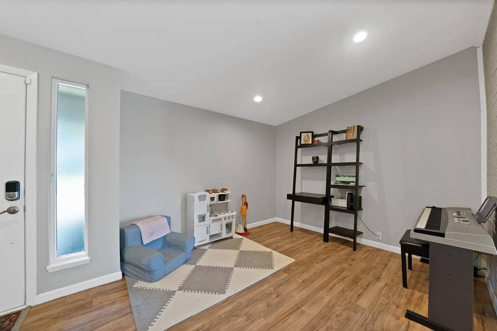 1400 Lorrie Drive, Richardson, TX 75080 Recreation room with light wood finished floors, recessed lighting, and vaulted ceiling