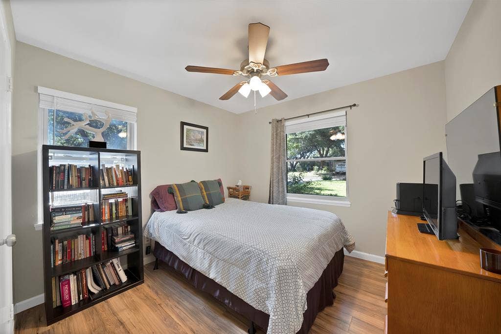 1400 Lorrie Drive, Richardson, TX 75080 Bedroom featuring wood finished floors and ceiling fan