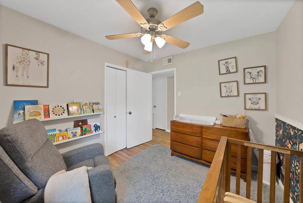 1400 Lorrie Drive, Richardson, TX 75080 Bedroom featuring a closet, wood finished floors, and a ceiling fan