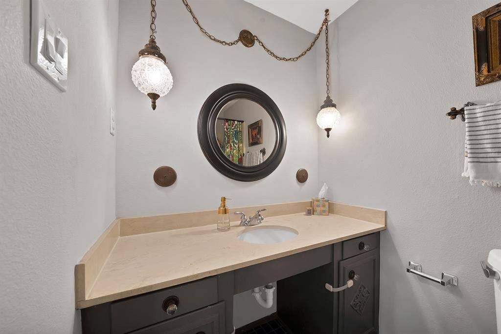 1400 Lorrie Drive, Richardson, TX 75080 Bathroom featuring a textured wall and vanity