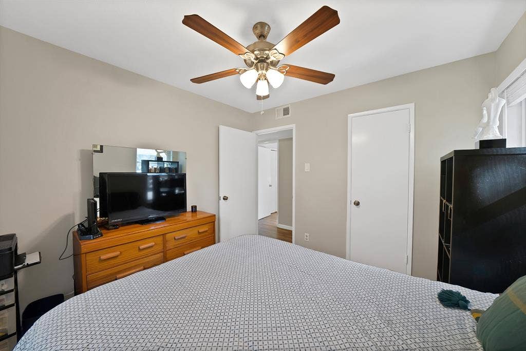1400 Lorrie Drive, Richardson, TX 75080 Bedroom featuring ceiling fan