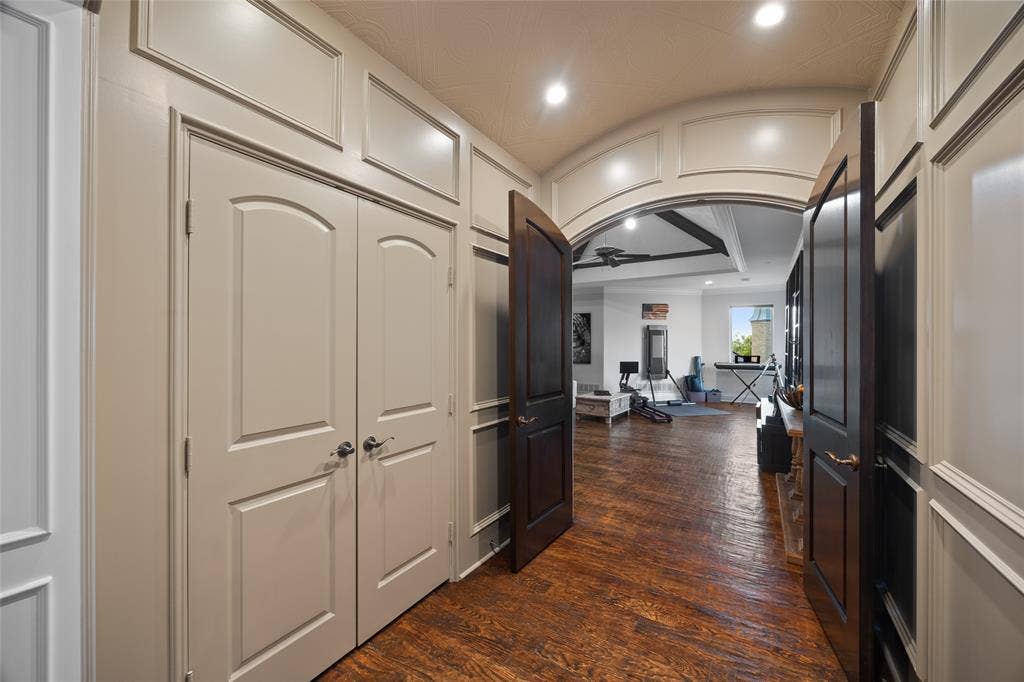 6300 Caroline Drive, Frisco, TX 75034 Arched entry with recessed lighting, wood-finish flooring, and wainscoting details