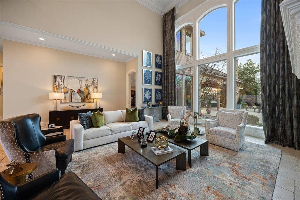 6300 Caroline Drive, Frisco, TX 75034 High ceilings with crown molding, recessed lighting, and expansive arched windows