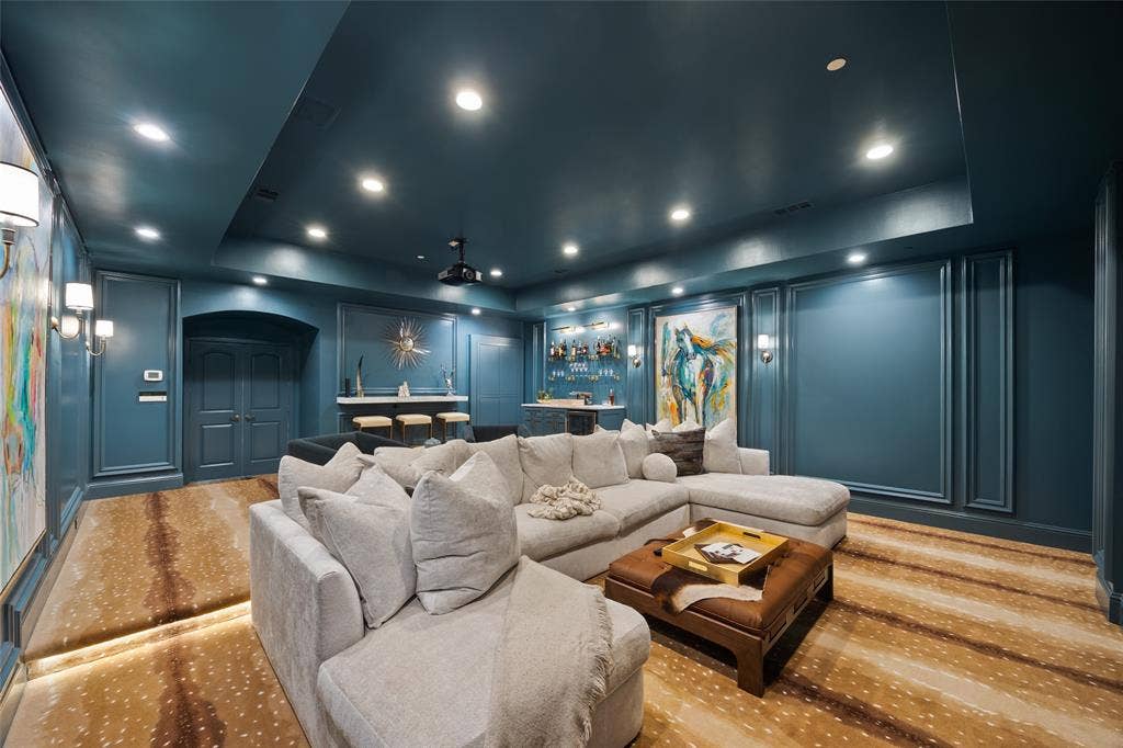 6300 Caroline Drive, Frisco, TX 75034 Recessed lighting illuminates the deep teal walls with decorative panel molding