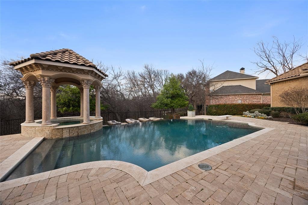 6300 Caroline Drive, Frisco, TX 75034 Expansive outdoor space featuring a swimming pool, integrated spa, and a tiled gazebo