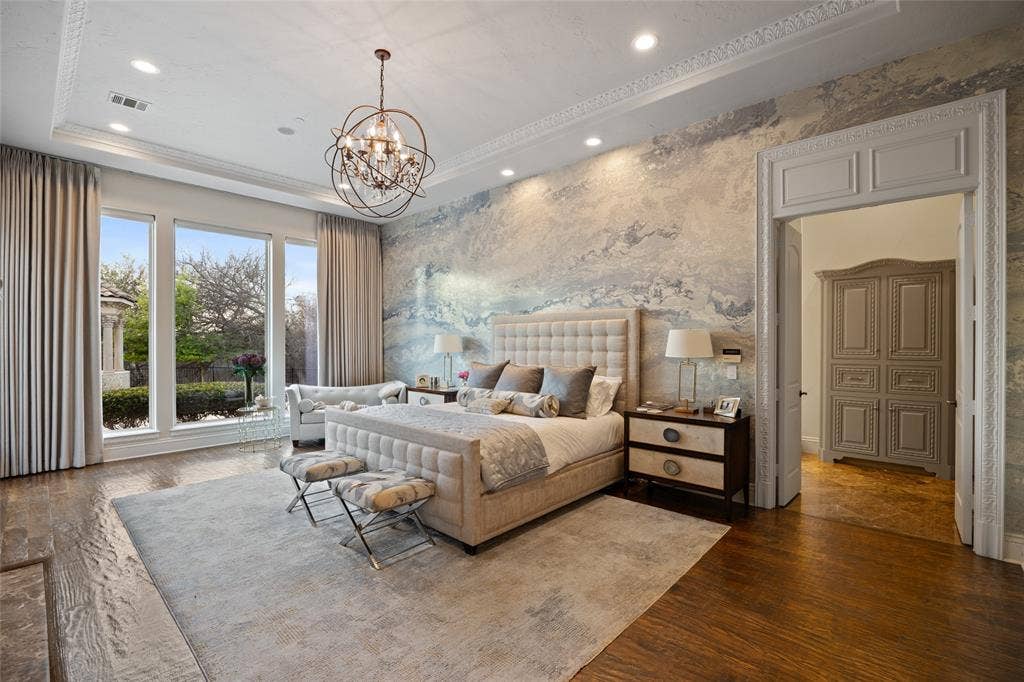 6300 Caroline Drive, Frisco, TX 75034 Hardwood-finish flooring, recessed lighting, decorative crown molding, and an ornate chandelier