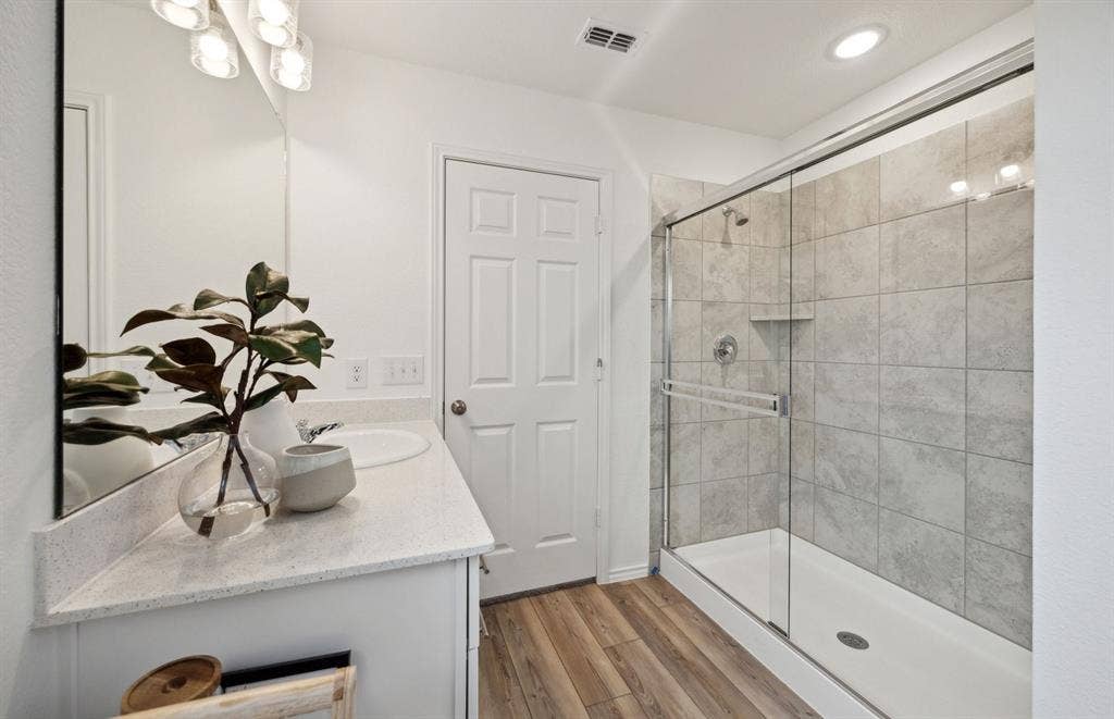 1060 Clear Dusk Lane, Forney, TX 75126 *Model Representation - Owner's suite bath with a long vanity and shower