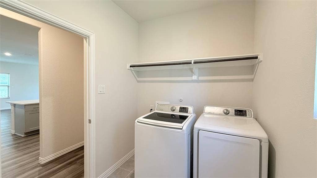 531 Deer Canyon Way, Princeton, TX 75407 Dedicated utility space featuring a built-in shelving unit and rod