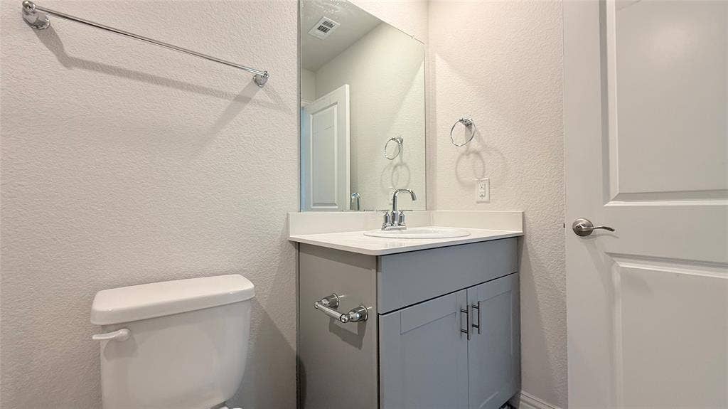 531 Deer Canyon Way, Princeton, TX 75407 White vanity with undermount sink, chrome faucet, and integrated countertop