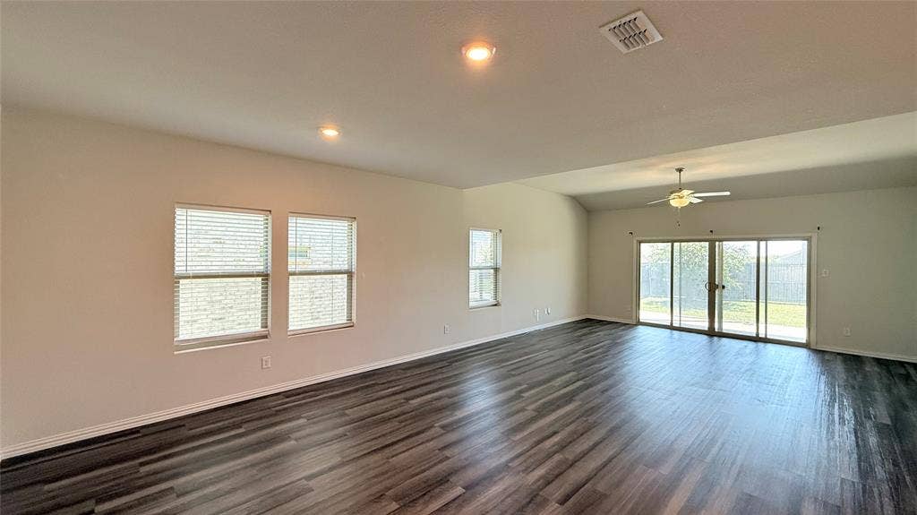 531 Deer Canyon Way, Princeton, TX 75407 Spacious interior featuring wood-finish flooring, vaulted ceiling, recessed lighting, and a ceiling fan