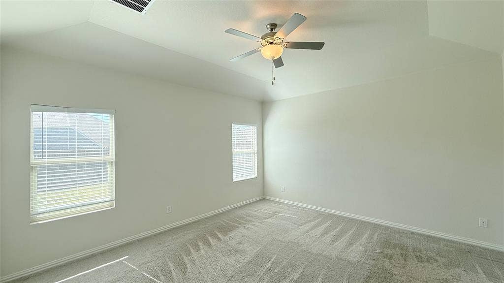 531 Deer Canyon Way, Princeton, TX 75407 Vaulted ceilings with a ceiling fan, dual windows with blinds, and light-toned carpeting