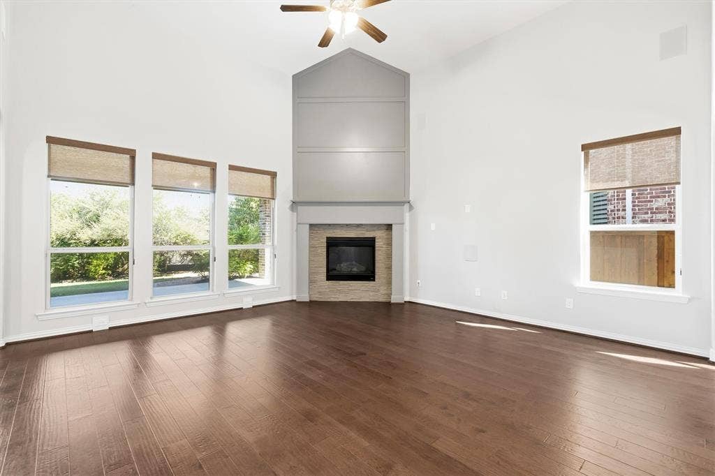 1839 Legendary Reef Way, St. Paul, TX 75098 Hardwood floors, frieplace and natural light enhance this space.