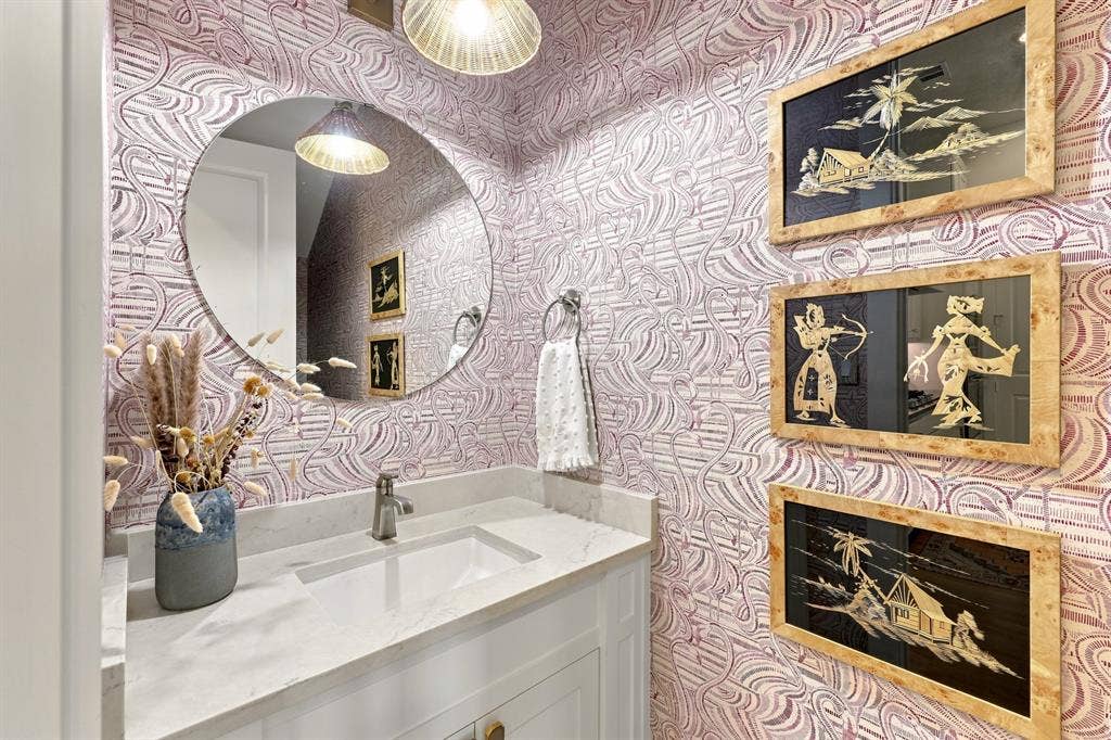 1137 Manderly Court, Dallas, TX 75204 White vanity with gold-tone hardware, rectangular undermount sink, and light-toned countertop