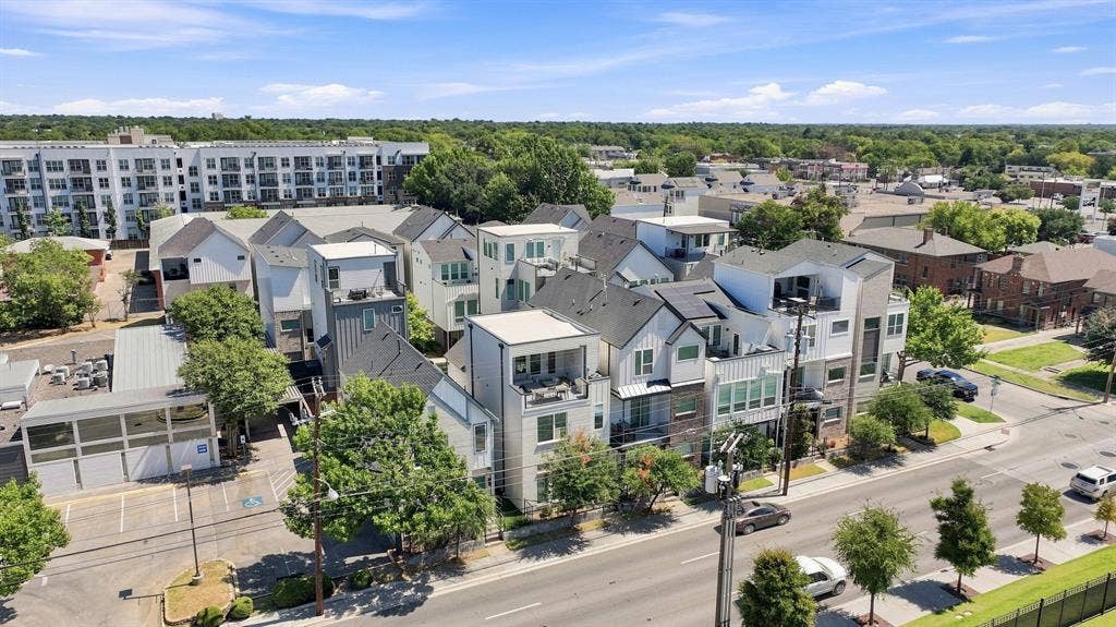 1137 Manderly Court, Dallas, TX 75204 Modern townhomes featuring multiple levels, balconies, and a mix of siding materials