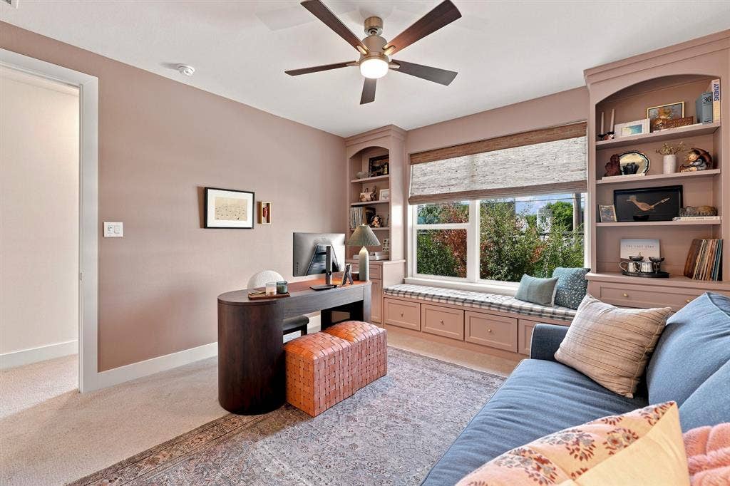 1137 Manderly Court, Dallas, TX 75204 Built-in window seat with storage, integrated shelving, and a ceiling fan with integrated lighting